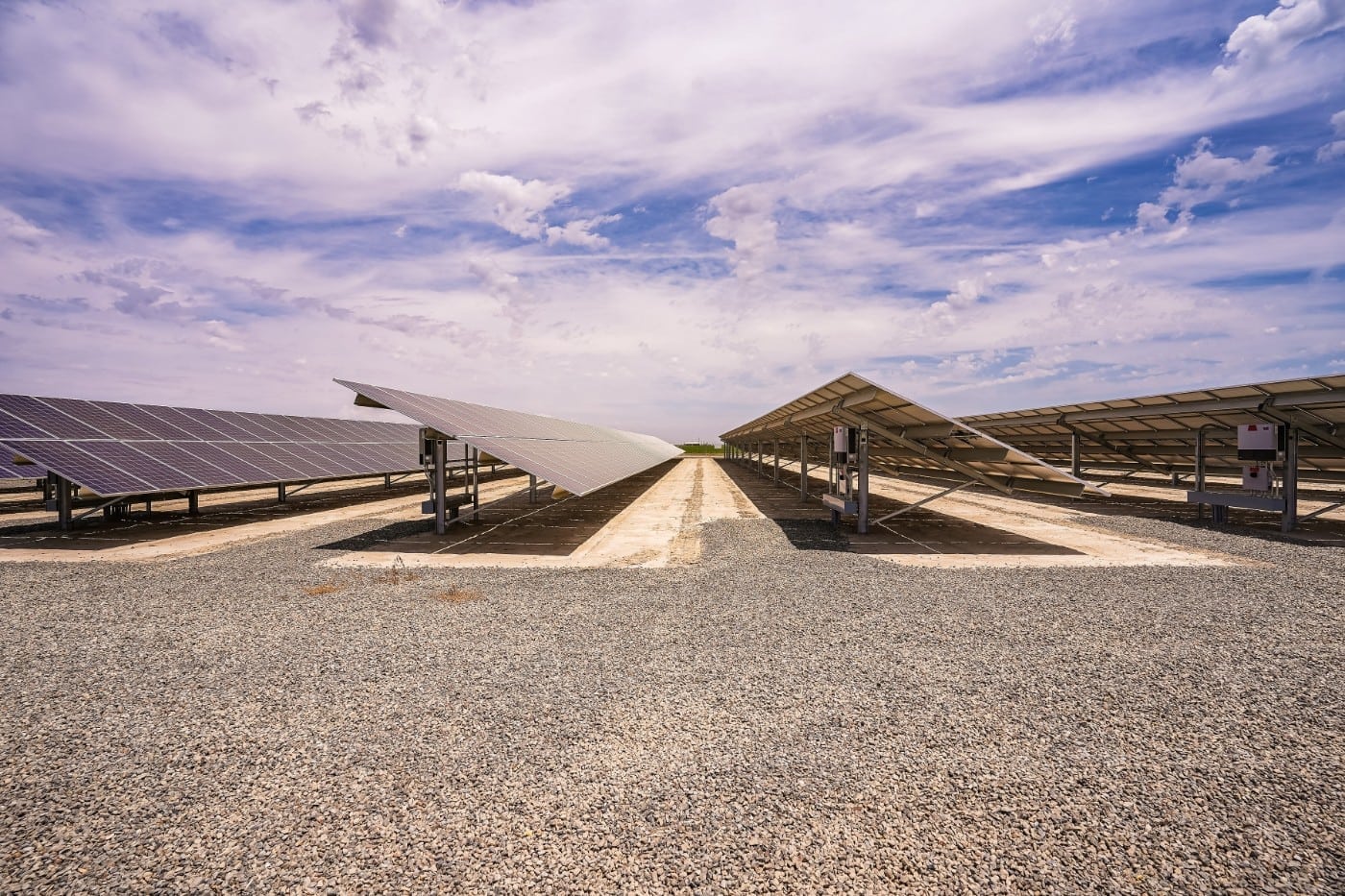 Ground view of rows of ground-mounted solar panels making up the solar farm at Johann Dairy in Fresno, California.