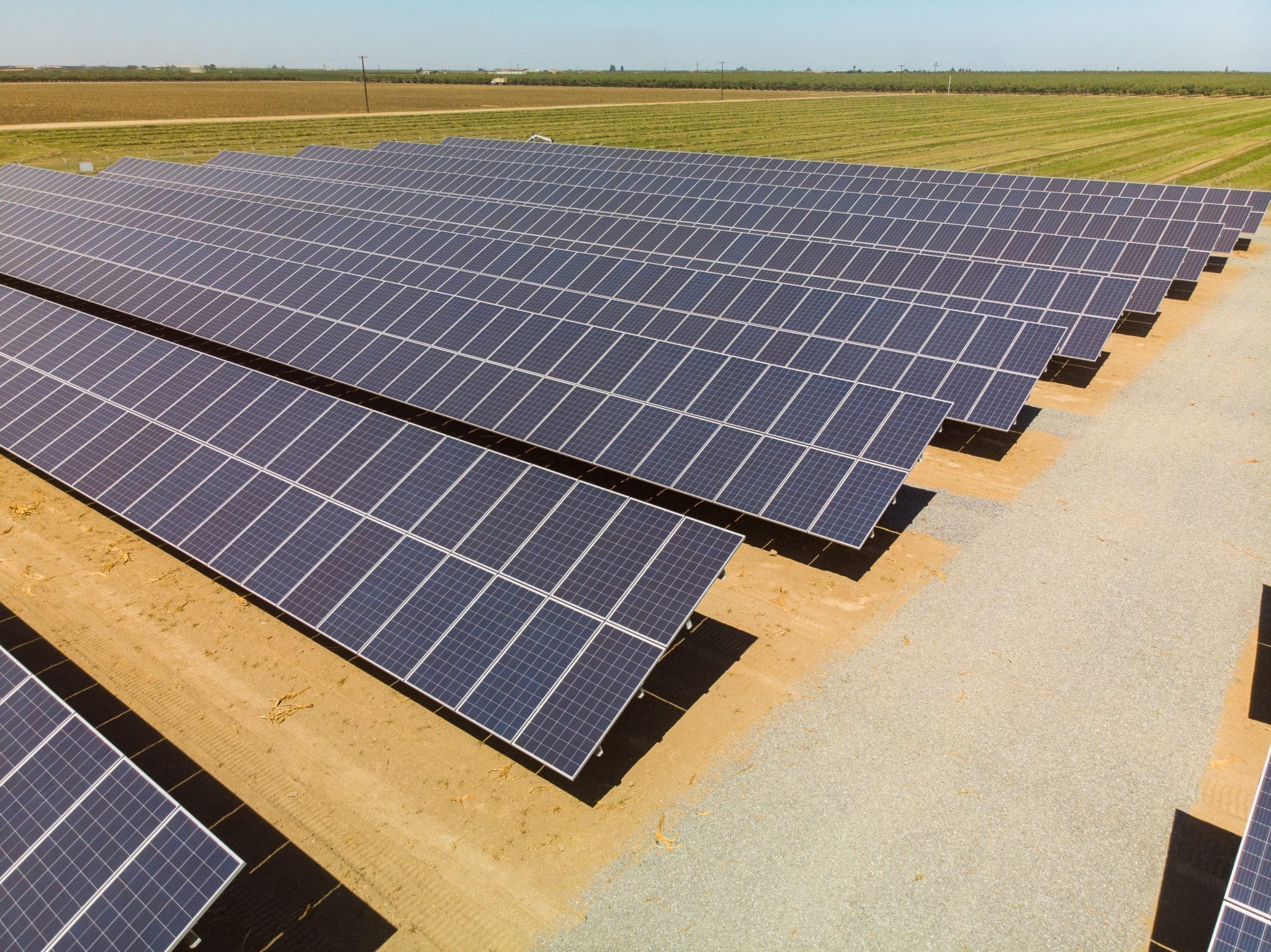 Closeup view of rows of ground-mounted solar panels at Skyview Dairy in Shafter, California.