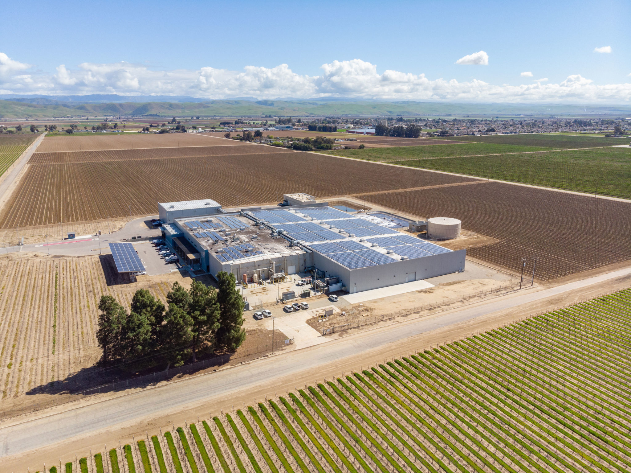 Aerial view of the solar panels on the J Lohr Vineyards & Wines building in Paso Robles, California, surrounded by farmland.