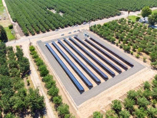 Aerial view of solar installation in California agricultural land. 
