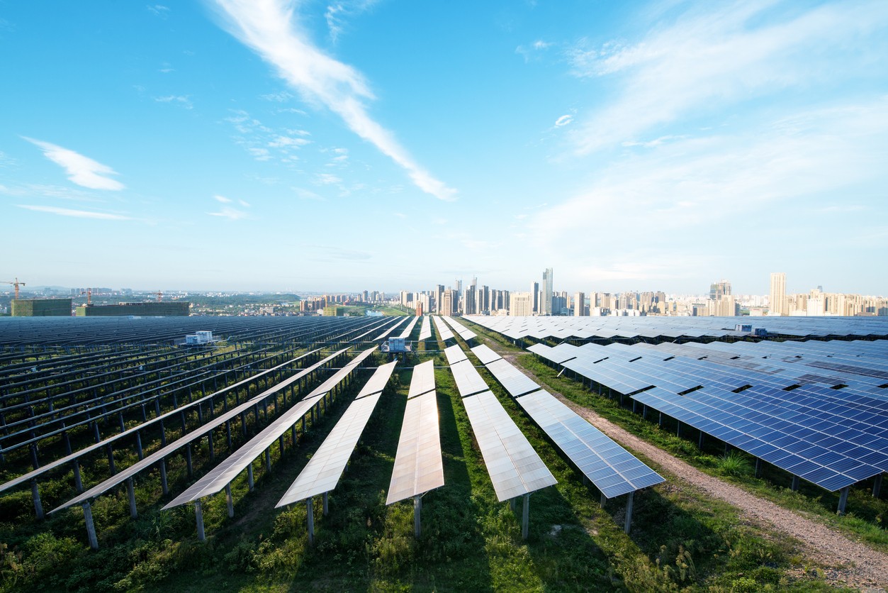 commercial-solar-panels-and-city-skyline