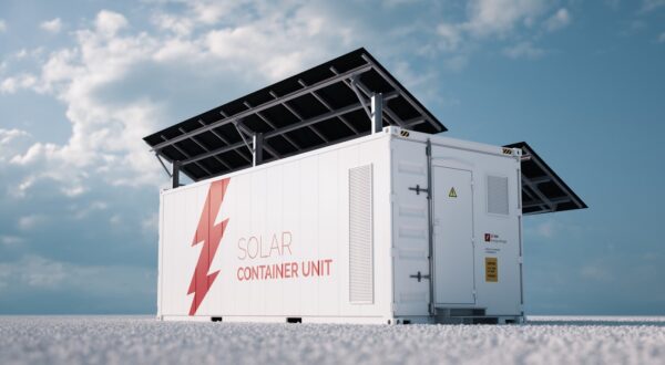 Solar energy battery storage unit with solar panels on roof. 
